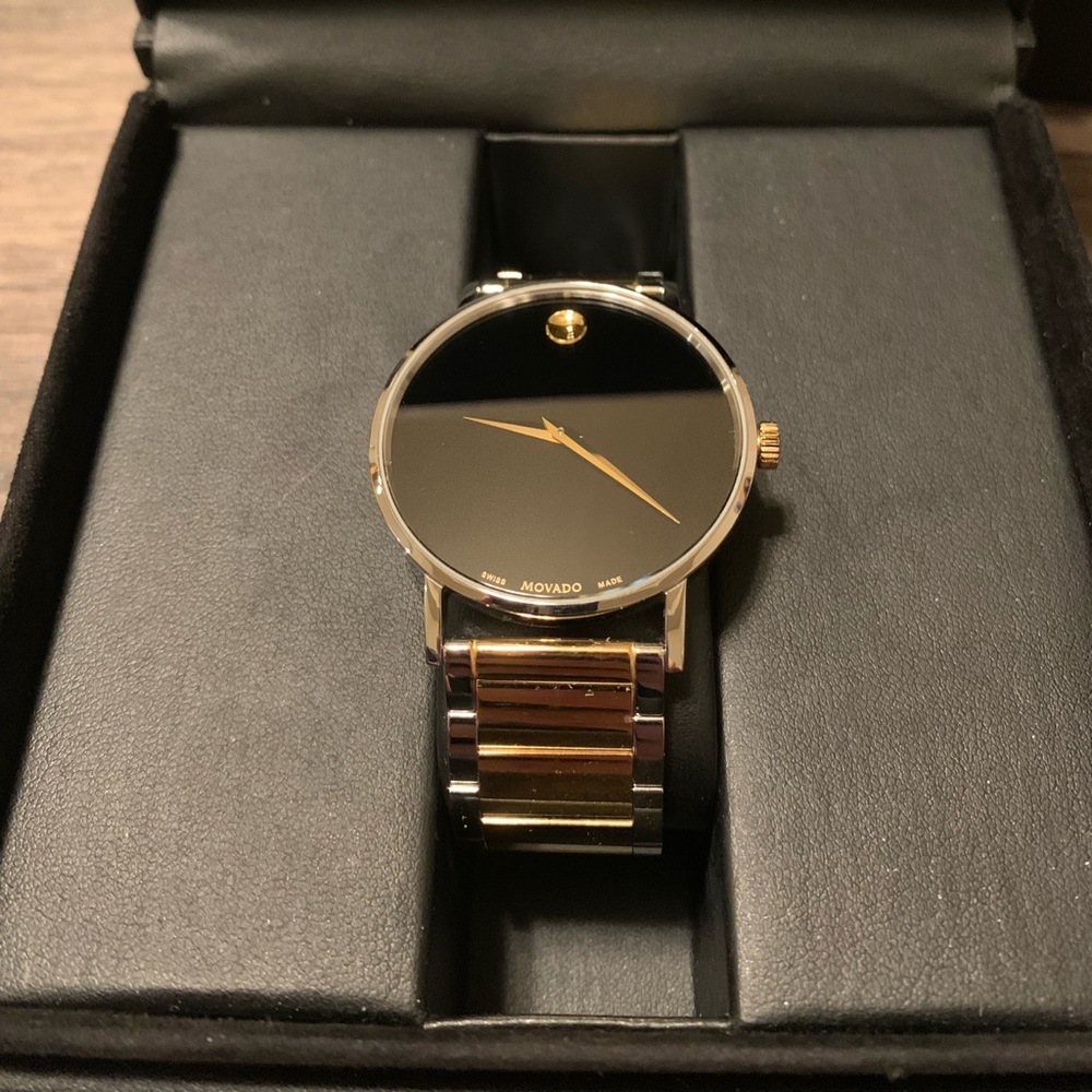 Movado Watch Silver and Gold with a black face. Links included